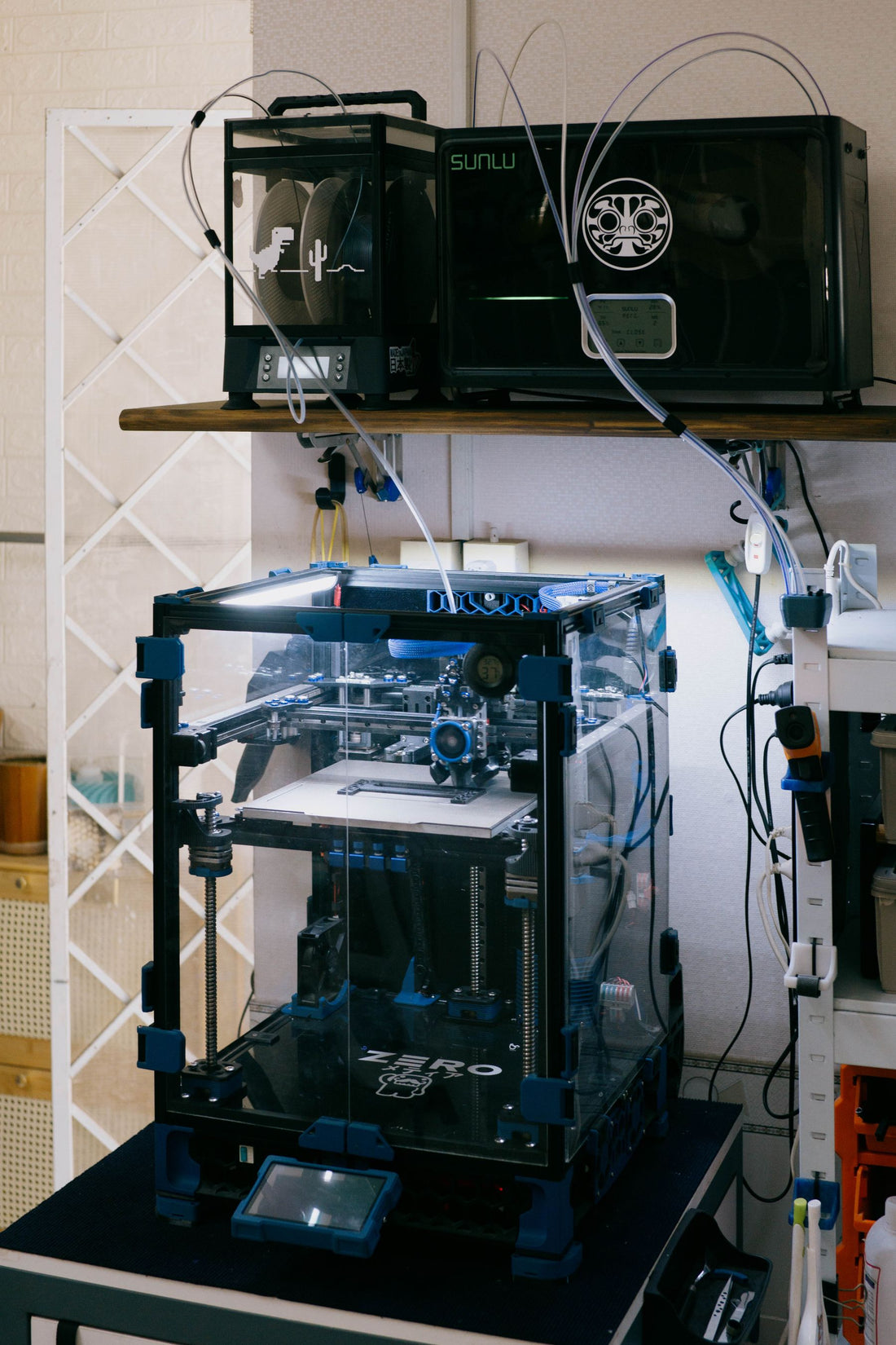Modern desktop 3D printer setup in a technology workshop